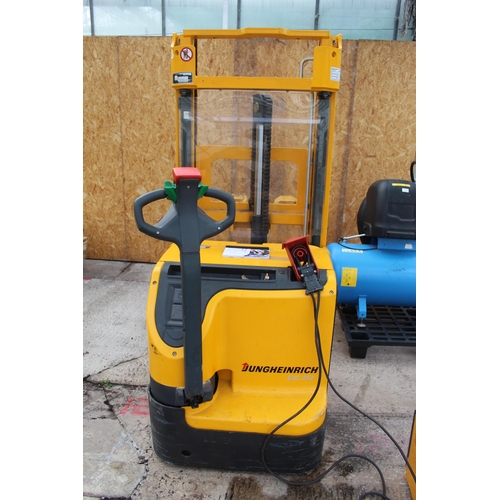 134 - JUNGHEINRICH BATTERY POWERED PALLET TRUCK WITH CHARGER - IN WORKING ORDER  + VAT