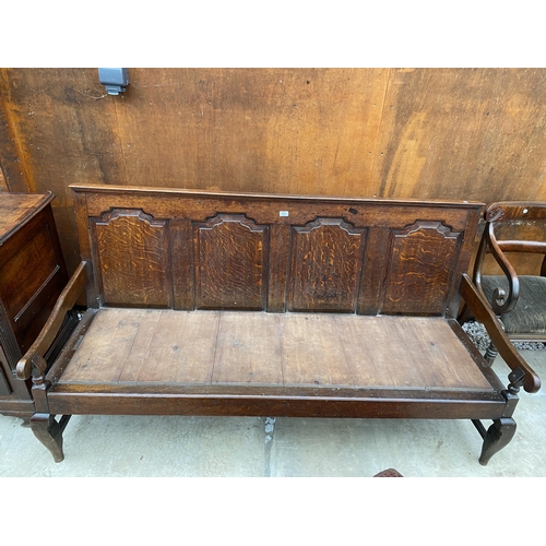 2527 - A GEORGE III OAK SETTLE WITH FOUR PANEL BACK, 72