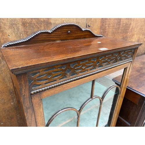 2529 - AN EARLY 20TH CENTURY OAK DISPLAY CABINET ON CABRIOLE LEGS, 26.5