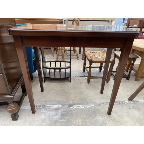 2533 - A 19TH CENTURY STYLE MAHOGANY FOLD OVER GAMES TABLE WITH GREEN BAIZE BEARING LABEL RALPH JOHNSON, CA... 