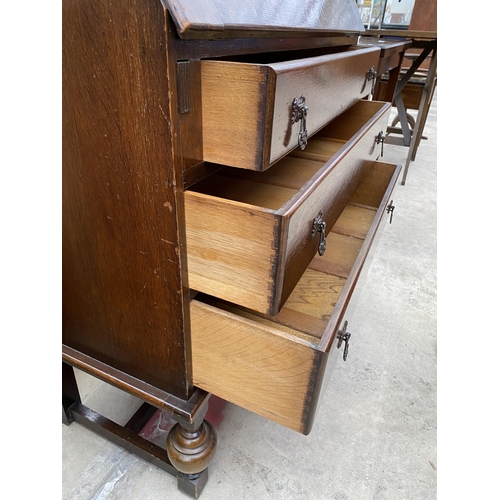 2534 - AN EARLY 20TH CENTURY OAK BUREAU BOOKCASE WITH GLAZED AND LEADED UPPER PORTION, 34.5