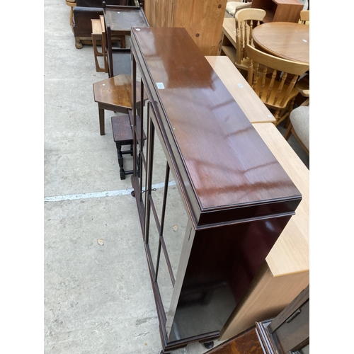 2535 - A MID 20TH CENTURY MAHOGANY GLAZED BOOKCASE ON CABRIOLE LEGS, 43