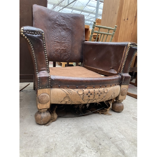 2538 - AN EARLY 20TH CENTURY LEATHER STUDDED FIRESIDE CHAIR