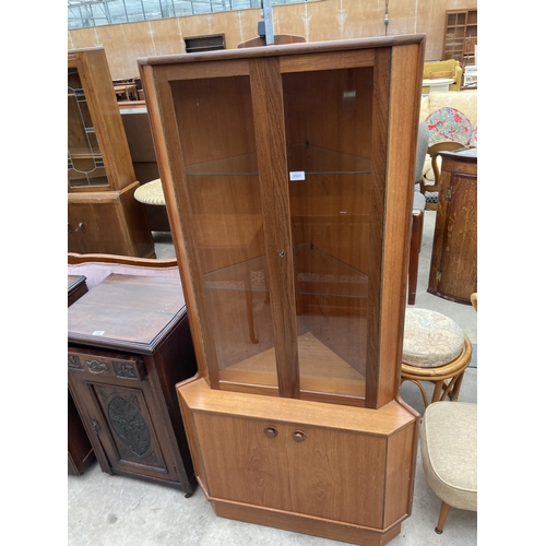 2551 - A TURNIDGE (LONDON) RETRO TEAK CORNER CUPBOARD WITH GLAZED UPPER PORTION, 34