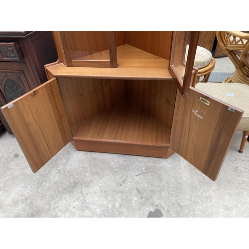 2551 - A TURNIDGE (LONDON) RETRO TEAK CORNER CUPBOARD WITH GLAZED UPPER PORTION, 34