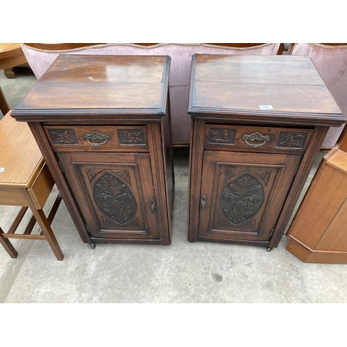 2552 - A PAIR OF VICTORIAN STYLE BEDSIDE POT CUPBOARDS WITH CARVED PANEL CUPBOARDS AND DRAWERS, 20