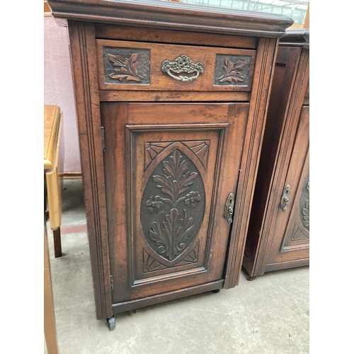 2552 - A PAIR OF VICTORIAN STYLE BEDSIDE POT CUPBOARDS WITH CARVED PANEL CUPBOARDS AND DRAWERS, 20