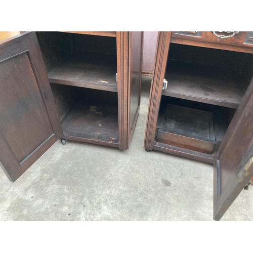 2552 - A PAIR OF VICTORIAN STYLE BEDSIDE POT CUPBOARDS WITH CARVED PANEL CUPBOARDS AND DRAWERS, 20