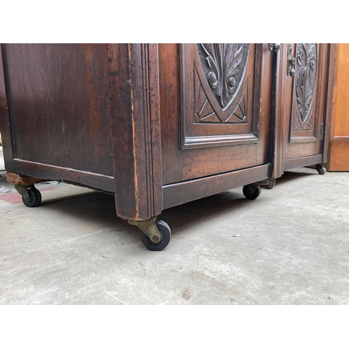 2552 - A PAIR OF VICTORIAN STYLE BEDSIDE POT CUPBOARDS WITH CARVED PANEL CUPBOARDS AND DRAWERS, 20