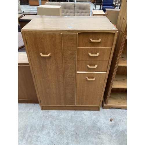 2556 - A G PLAN E GOMME OAK TALLBOY ENCLOSING THREE DRAWERS, ONE CUPBOARD AND ONE HANGING SECTION, 35