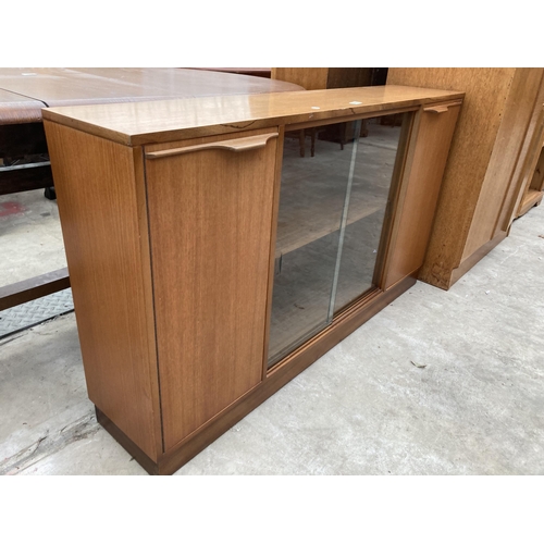 2557 - A RETRO TEAK BOOKCASE WITH TWO SLIDING GLASS DOORS AND TWO CUPBOARDS, 54