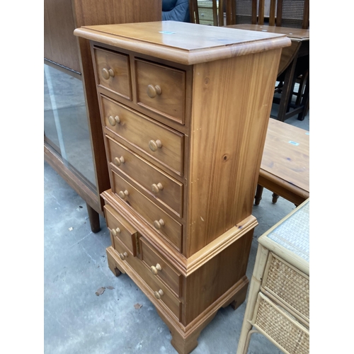 2561 - A PINE CHEST ON CHEST ENCLOSING EIGHT DRAWERS, 18