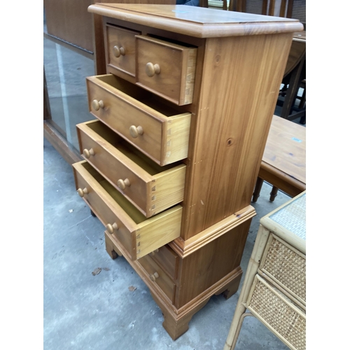 2561 - A PINE CHEST ON CHEST ENCLOSING EIGHT DRAWERS, 18