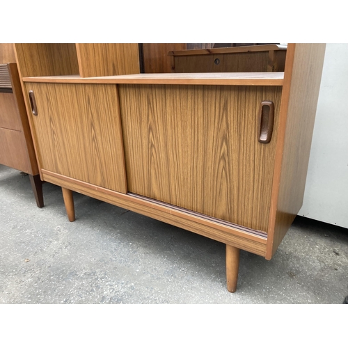 2567 - A SCHREIBER RETRO TEAK DISPLAY UNIT WITH FOUR SLIDING DOORS, TWO BEING GLASS, 42