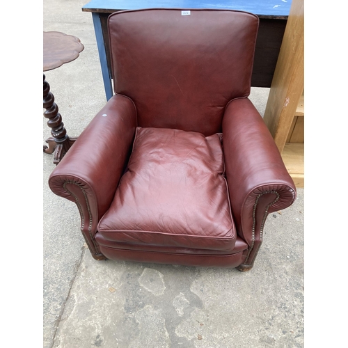 2576 - A LEATHER EASY CHAIR WITH BUN FRONT FEET