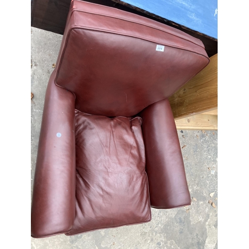 2576 - A LEATHER EASY CHAIR WITH BUN FRONT FEET