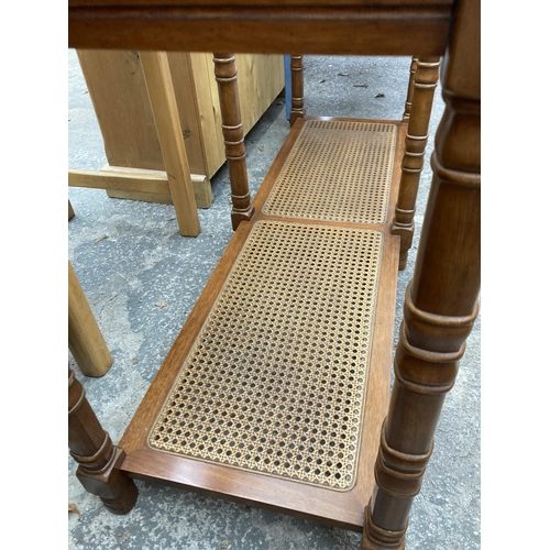 2579 - A HARDWOOD TABLE WITH INSET GLASS TOP AND SPLIT CANE 2ND TIER, 50