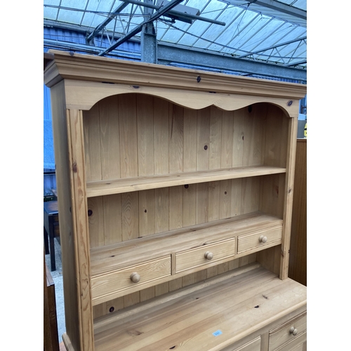 2581 - A PINE DRESSER WITH CUPBOARDS AND DRAWERS TO BASE HAVING PLATE RACK ENCLOSING THREE DRAWERS, 50