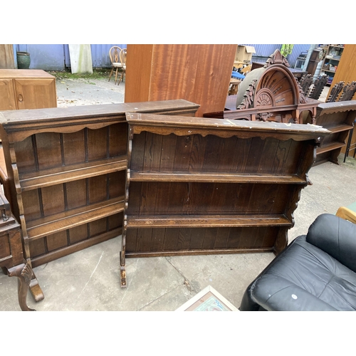 2586 - TWO OAK DRESSER RACKS