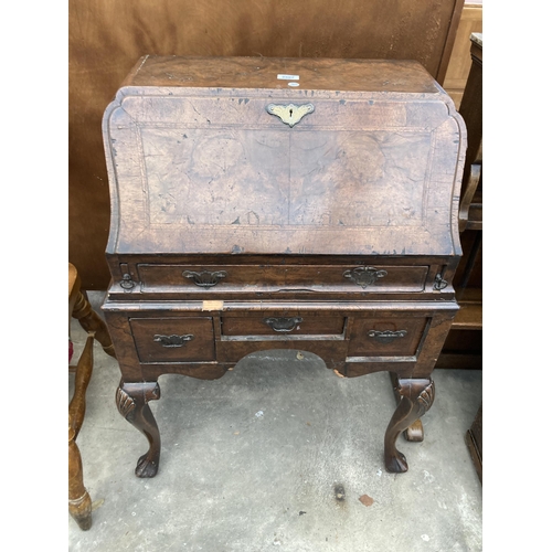 2587 - AN EARLY 20TH CENTURY WALNUT AND CROSSBANDED BUREAU ON CABRIOLE LEGS, 26.5