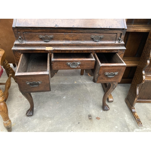 2587 - AN EARLY 20TH CENTURY WALNUT AND CROSSBANDED BUREAU ON CABRIOLE LEGS, 26.5