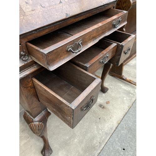 2587 - AN EARLY 20TH CENTURY WALNUT AND CROSSBANDED BUREAU ON CABRIOLE LEGS, 26.5