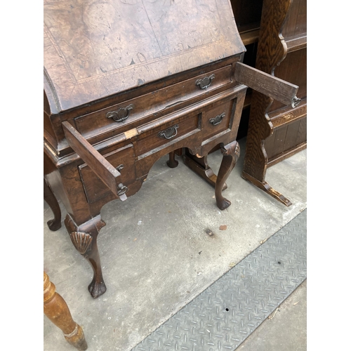 2587 - AN EARLY 20TH CENTURY WALNUT AND CROSSBANDED BUREAU ON CABRIOLE LEGS, 26.5