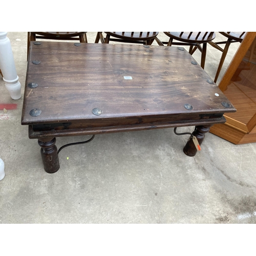 2631 - A HARDWOOD STUDDED COFFEE TABLE ON TURNED LEGS, 36