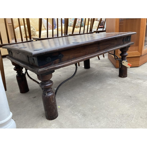 2631 - A HARDWOOD STUDDED COFFEE TABLE ON TURNED LEGS, 36