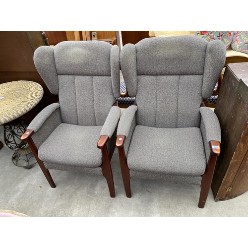 2635 - A PAIR OF OXFORD WINGED FIRESIDE CHAIRS