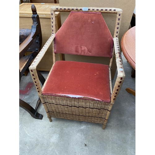 2639 - A WICKER ELBOW CHAIR WITH LIFT UP SEAT