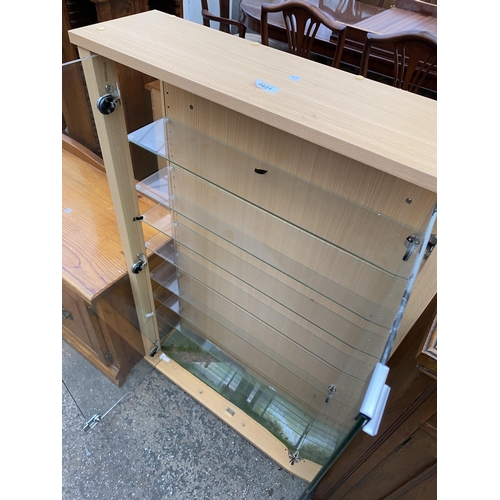 2651 - A TWO DOOR DISPLAY CASE WITH EIGHT GLASS SHELVES, 27