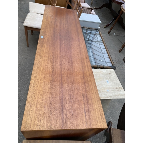 2653 - A RETRO TEAK SIDEBOARD ENCLOSING THREE DRAWERS AND THREE CUPBOARDS, 63