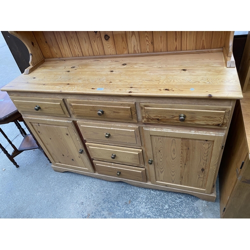 2656 - A PINE DRESSER ENCLOSING SIX DRAWERS, TWO CUPBOARDS AND PLATE RACK, 55.5