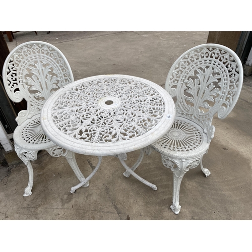 1501 - A WHITE CAST ALLOY BISTRO SET COMPRISING OF A ROUND TABLE AND TWO CHAIRS