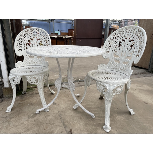 1501 - A WHITE CAST ALLOY BISTRO SET COMPRISING OF A ROUND TABLE AND TWO CHAIRS