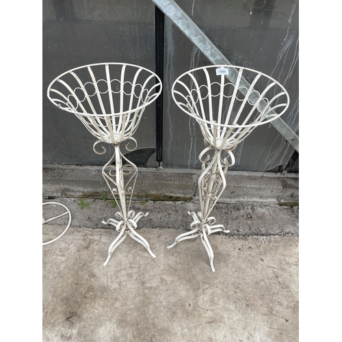 1502 - A PAIR OF DECORATIVE WHITE PAINTED METAL PLANT STANDS