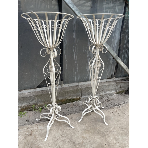 1502 - A PAIR OF DECORATIVE WHITE PAINTED METAL PLANT STANDS