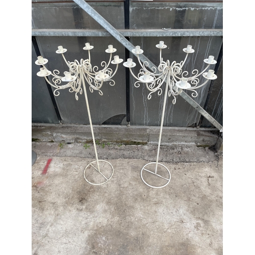 1503 - A PAIR OF WHITE PAINT METAL EIGHT BRANCH CANDLESTICKS