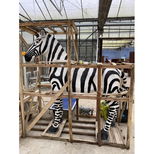 1762 - A LARGE FIBRE GLASS ZEBRA GARDEN FEATURE, SMALL REPAIR TO LOWER FRONT LEFT LEG (H:184CM L:178CM)