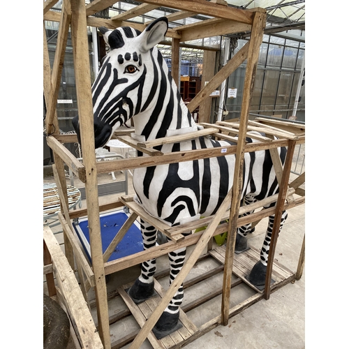 1762 - A LARGE FIBRE GLASS ZEBRA GARDEN FEATURE, SMALL REPAIR TO LOWER FRONT LEFT LEG (H:184CM L:178CM)