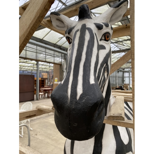 1762 - A LARGE FIBRE GLASS ZEBRA GARDEN FEATURE, SMALL REPAIR TO LOWER FRONT LEFT LEG (H:184CM L:178CM)