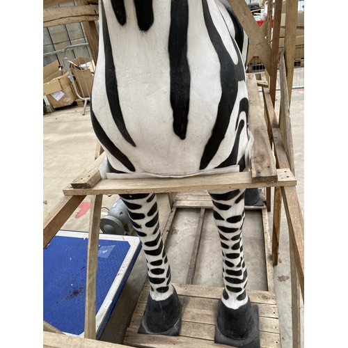 1762 - A LARGE FIBRE GLASS ZEBRA GARDEN FEATURE, SMALL REPAIR TO LOWER FRONT LEFT LEG (H:184CM L:178CM)