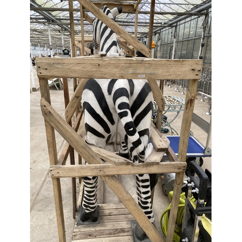 1762 - A LARGE FIBRE GLASS ZEBRA GARDEN FEATURE, SMALL REPAIR TO LOWER FRONT LEFT LEG (H:184CM L:178CM)