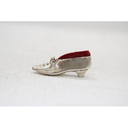 12 - A STERLING SILVER SHOE PIN CUSHION