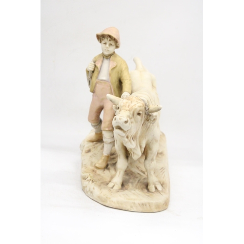 2 - AN EARLY 20TH CENTURY BISQUE PORCELAIN ROYAL DUX FIGURE OF A YOUNG MAN BESIDE A HARNESSED OX - PINK ... 