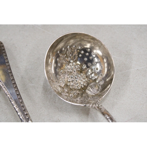 33 - THREE GEORGIAN SILVER ITEMS TO INCLUDE TWO DECORATIVE SERVING SPOONS AND A LADLE GROSS WEIGHT 181.8 ... 