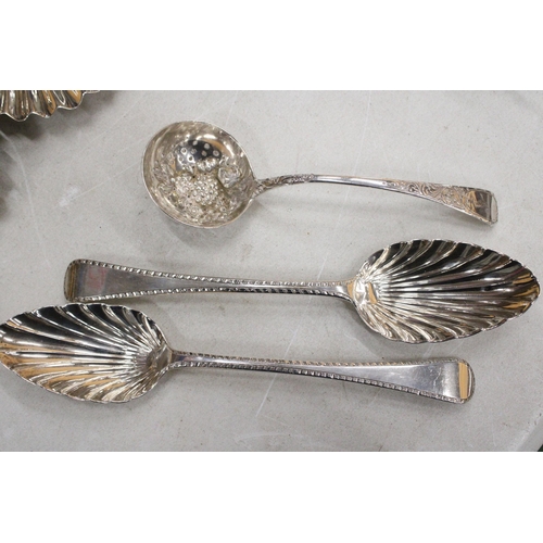 33 - THREE GEORGIAN SILVER ITEMS TO INCLUDE TWO DECORATIVE SERVING SPOONS AND A LADLE GROSS WEIGHT 181.8 ... 