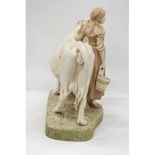 45 - A ROYAL DUX BISQUE PORCELAIN EARLY 20TH CENTURY FIGURE GROUP MODELLED AS A MILKMAID WITH COW