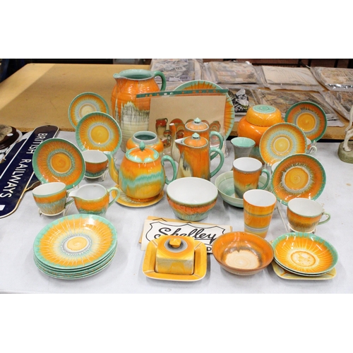 46 - A VINTAGE 1930'S SHELLEY HARMONY ORNAGE/GREEN DRIPWARE TO INCLUDE TEAPOT, TRIVET, HOT WATER POT, BUT... 